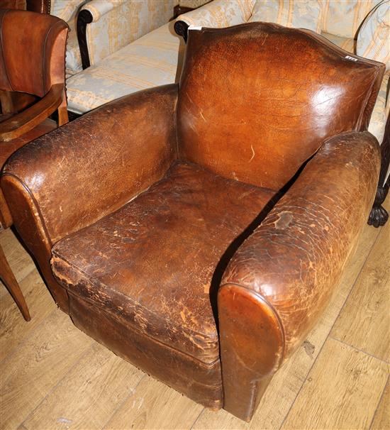 A 1930s French brown leather armchair